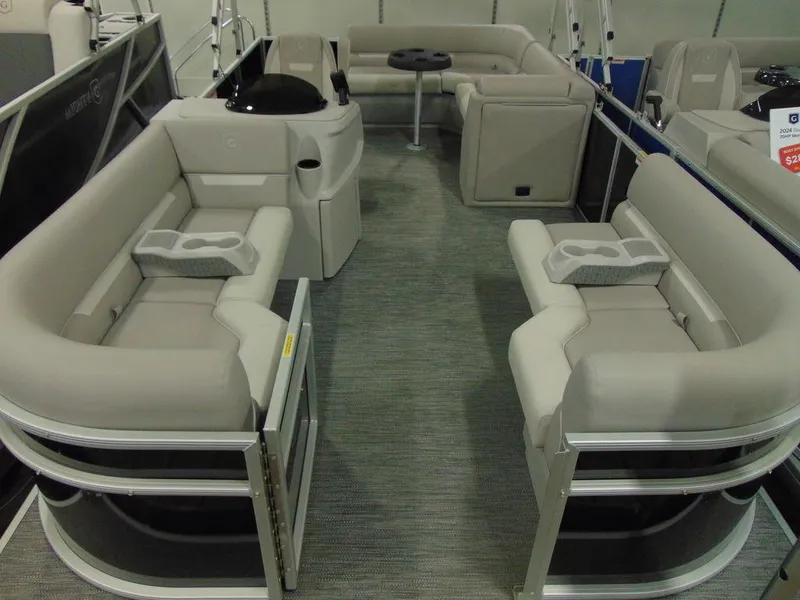 Slide: The Image of 2024 Godfrey Xperience 1880 FX 25 in. Package pontoon boat interior with beige seating. - 3