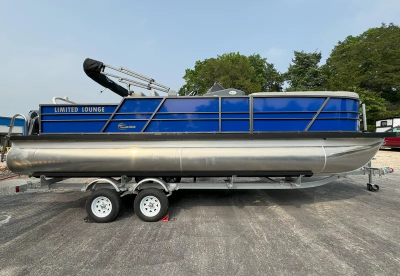 The Image of 2024 Massimo Marine P24-Limited Lounge Tritoon boat on a trailer. - 0