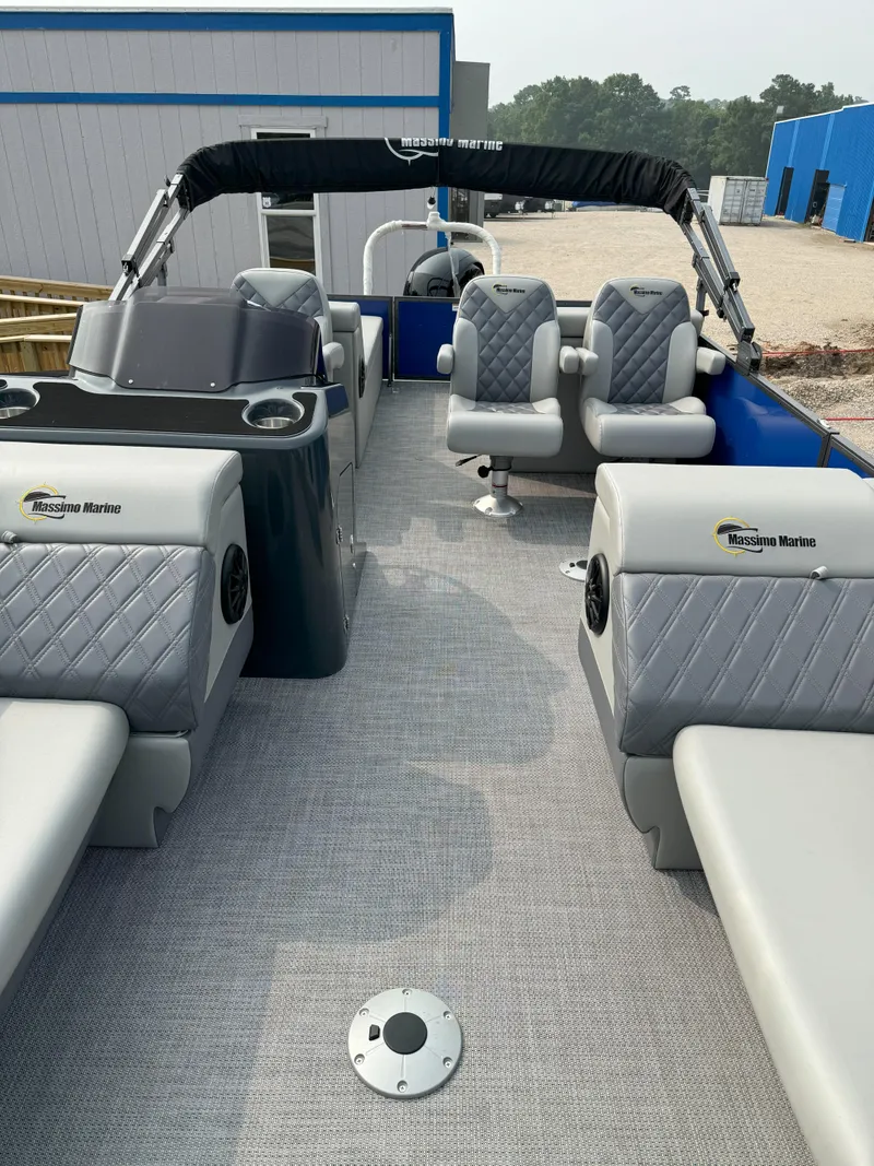 Slide: The Image of 2024 Massimo Marine P24-Limited Lounge Tritoon with luxurious seating and modern design. - 2