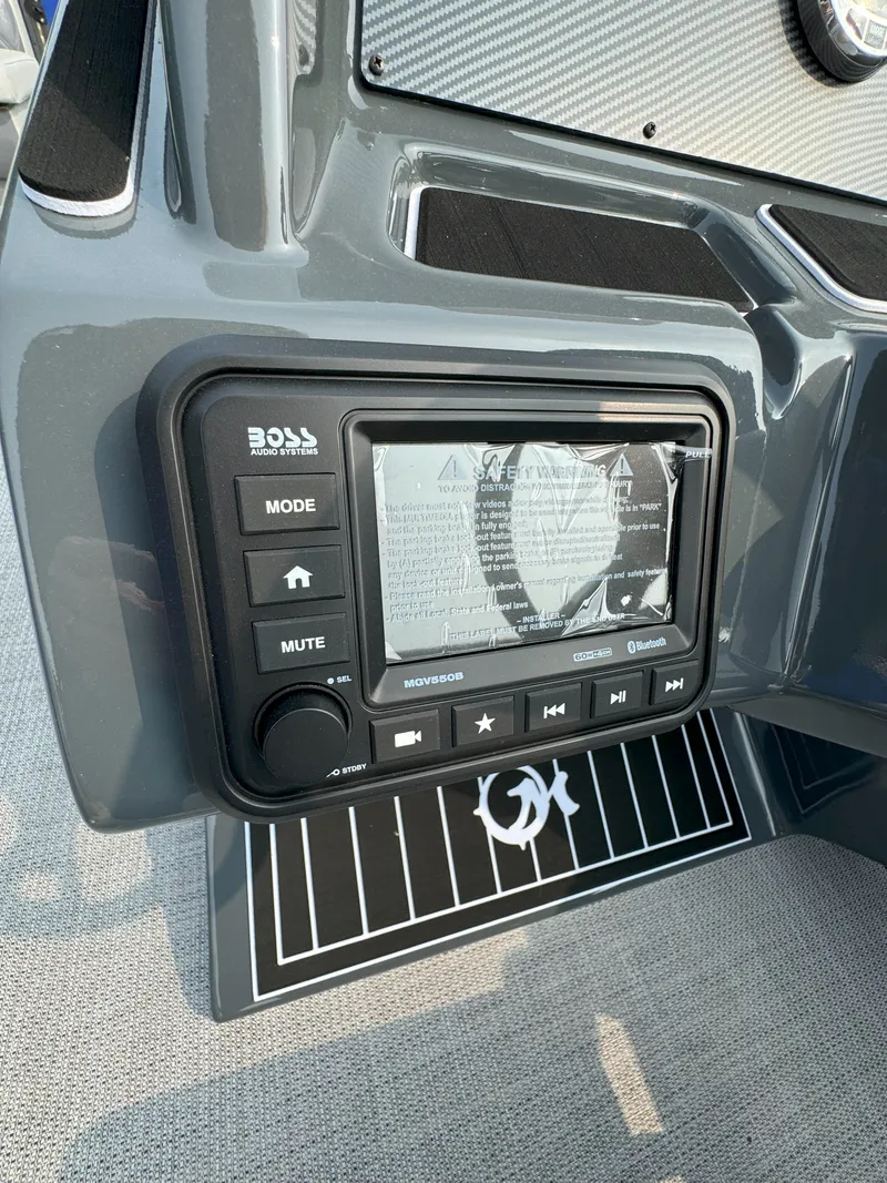 Slide: The Image of 2024 Massimo Marine P24-Limited Lounge Tritoon dashboard with Boss audio system. - 6