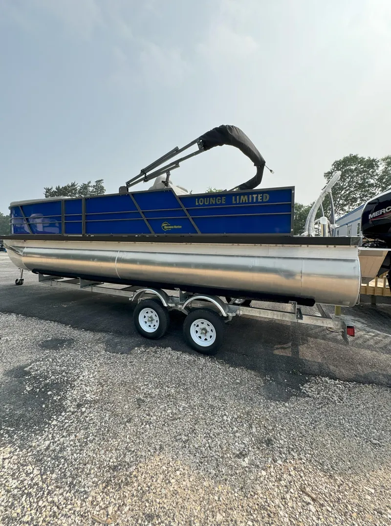 Slide: The Image of 2024 Massimo Marine P24-Limited Lounge Tritoon on trailer. - 9