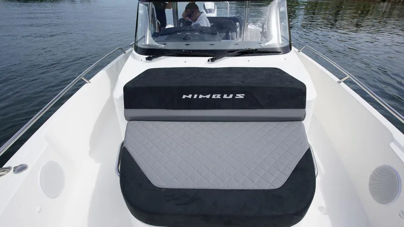 Slide: The Image of 2024 Nimbus Tender 9 #143 boat with cushioned seating on water. - 15