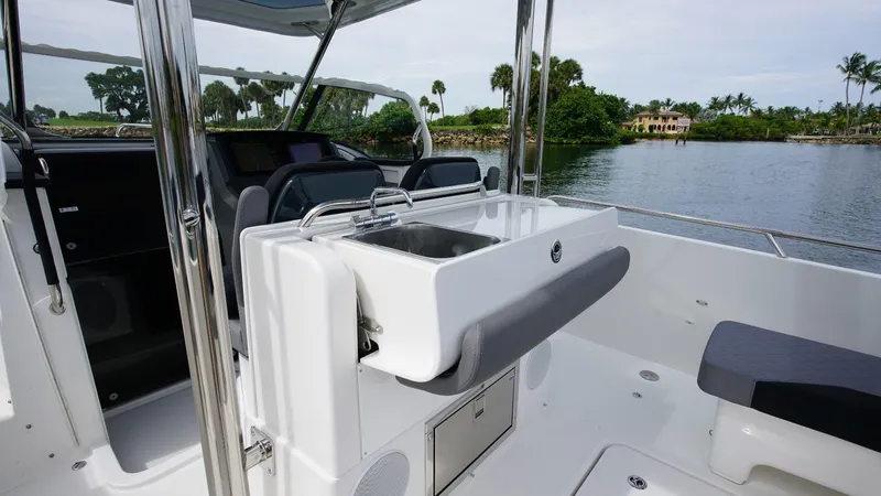 Slide: The Image of 2024 Nimbus Tender 9 #143 boat interior with sink and seating area. - 5