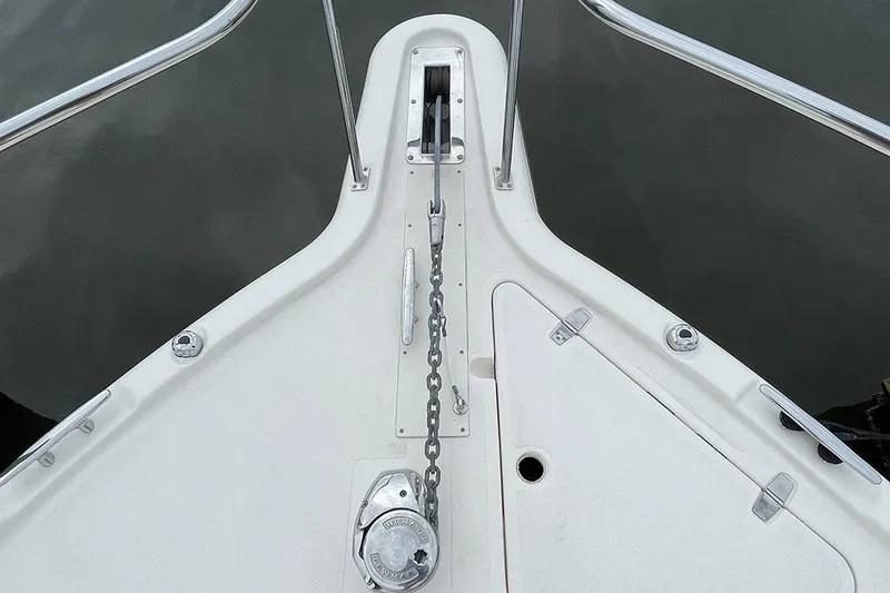 Slide: The Image of Bow of 2009 Pursuit OS 375 Offshore with anchor chain and windlass. - 11