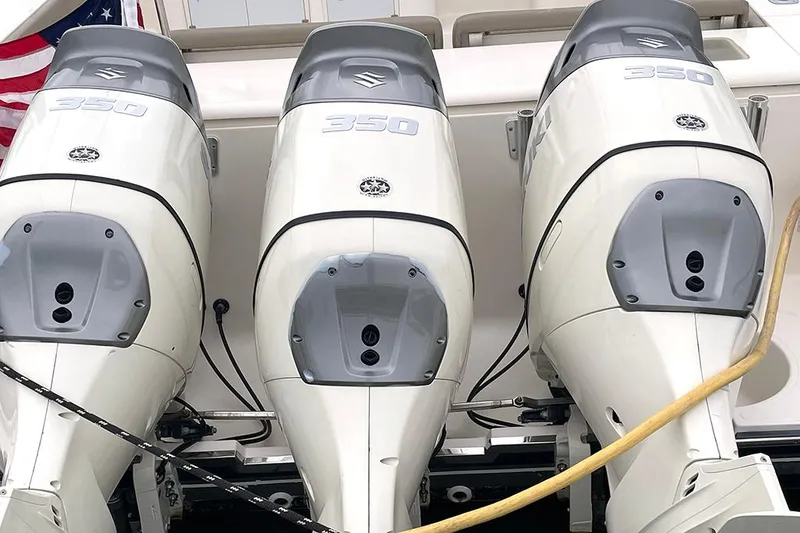 Slide: The Image of Triple Suzuki 350 outboard engines on a 2009 Pursuit OS 375 Offshore boat. - 24