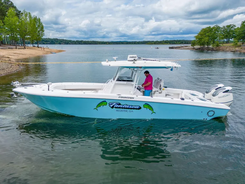 The Image of 2019 Fountain 34CC boat on a lake with a person onboard. - 0