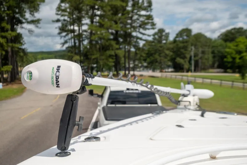 Slide: The Image of Close-up of a 2019 Fountain 34CC boat with a trolling motor. - 12