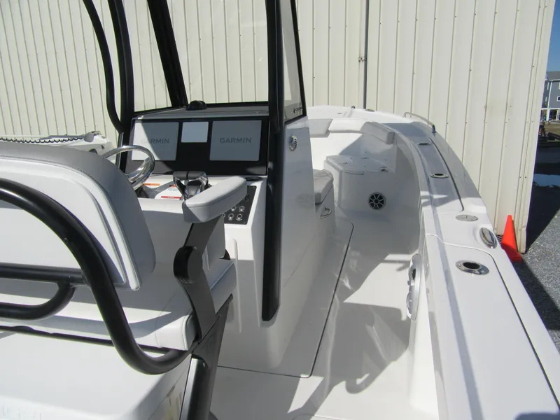 Slide: The Image of 2025 Parker 2600 Center Console boat with modern navigation system, sleek design, and spacious deck. - 12