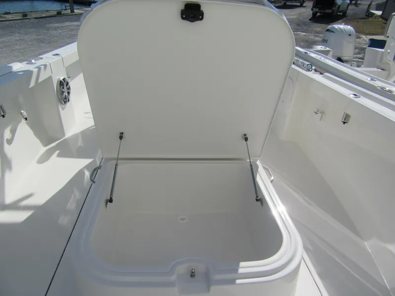 Slide: The Image of 2025 Parker 2600 Center Console boat storage compartment open on deck. - 4