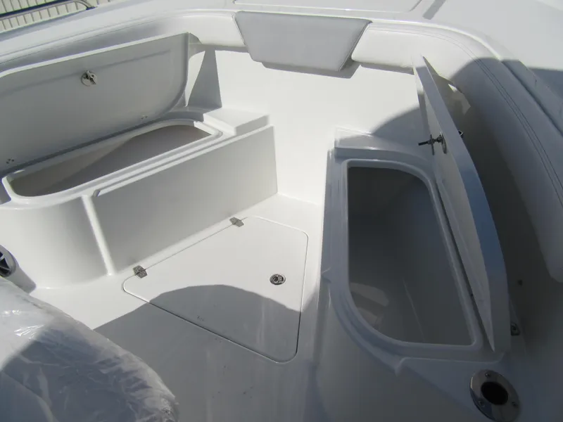 Slide: The Image of 2025 Parker 2600 Center Console boat interior with open storage compartments. - 7
