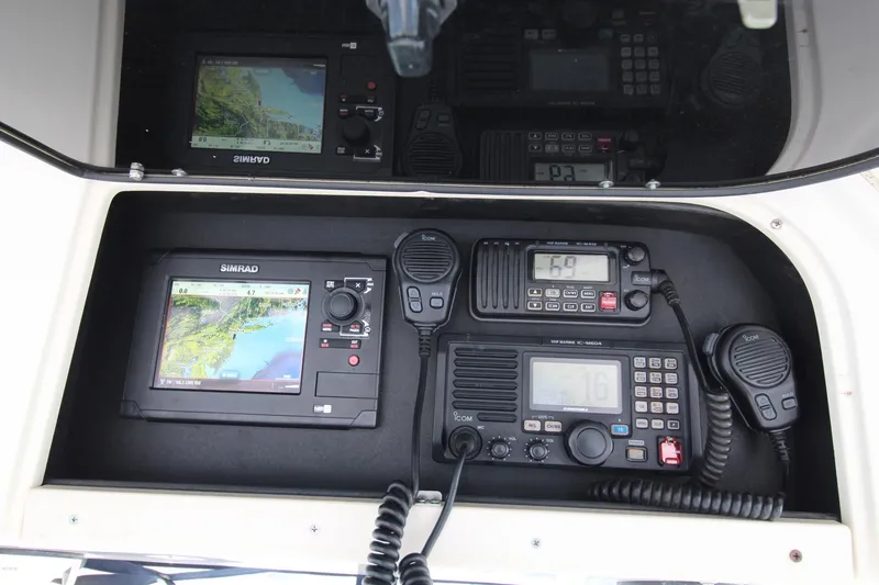 Slide: The Image of Navigation and communication equipment on a 2002 Grady-White Express 265 boat. - 12