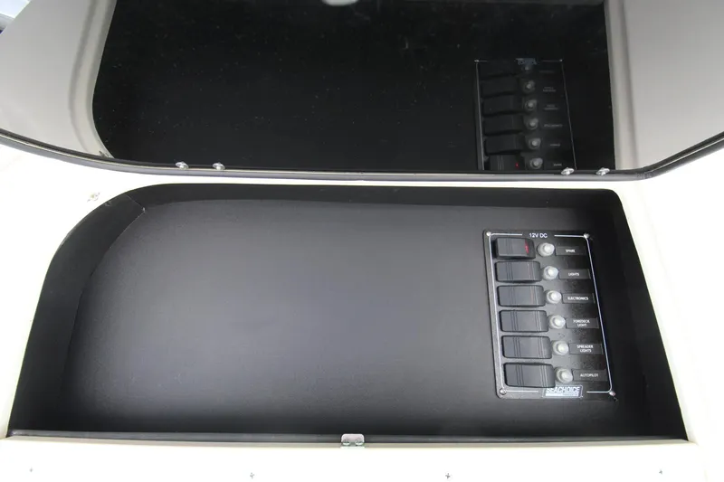 Slide: The Image of 2002 Grady-White Express 265 control panel with labeled switches. - 13