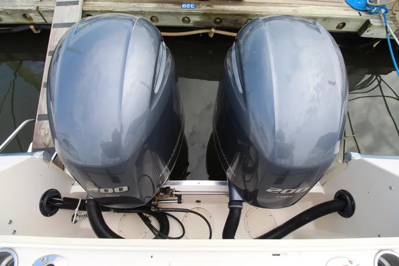Slide: The Image of Twin Yamaha 200 outboard engines on a 2002 Grady-White Express 265 boat. - 29