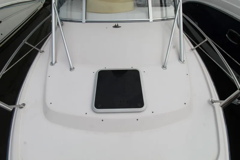 Slide: The Image of 2002 Grady-White Express 265 boat deck with hatch and railing. - 4