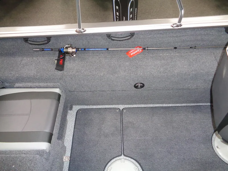 Slide: The Image of 2024 Lund 1775 Impact XS interior with fishing rod storage. - 14