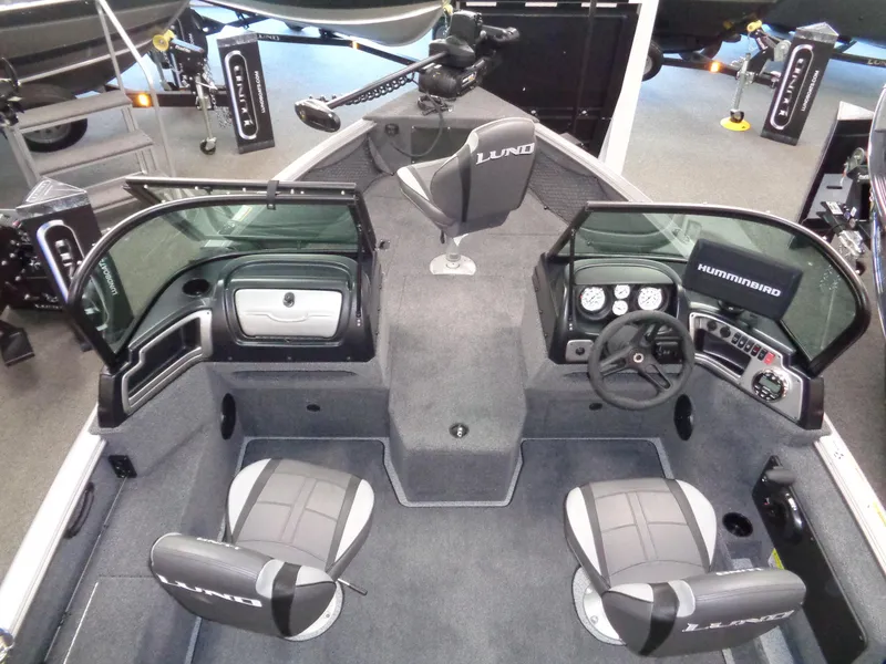 Slide: The Image of 2024 Lund 1775 Impact XS boat interior with seating and control console. - 19