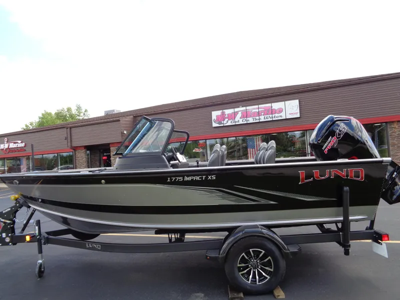 Slide: The Image of 2024 Lund 1775 Impact XS fishing boat on trailer. - 2