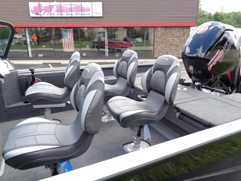 Slide: The Image of 2024 Lund 1775 Impact XS boat interior with seating and motor. - 20