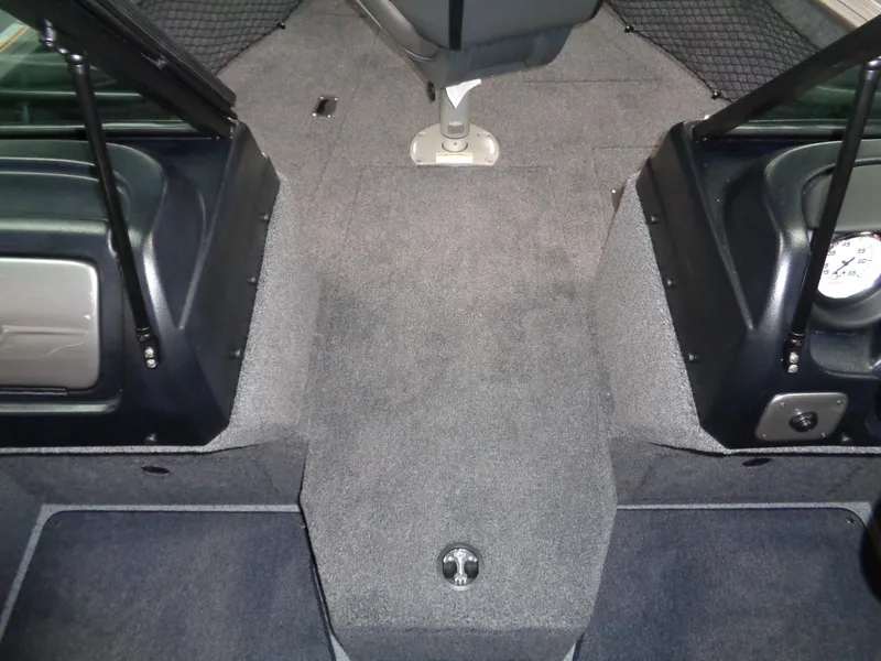 Slide: The Image of 2024 Lund 1775 Impact XS boat interior, carpeted deck and seating area. - 22