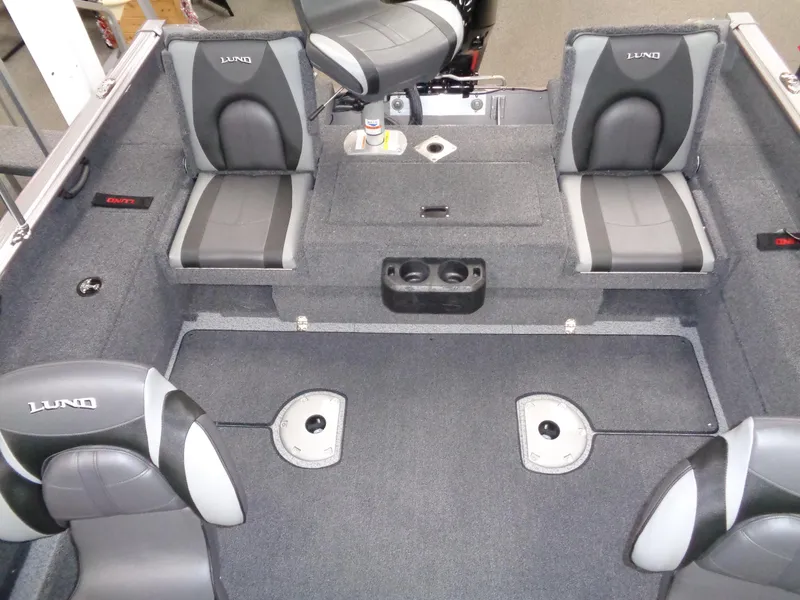 Slide: The Image of 2024 Lund 1775 Impact XS boat interior with seating and storage compartments. - 31