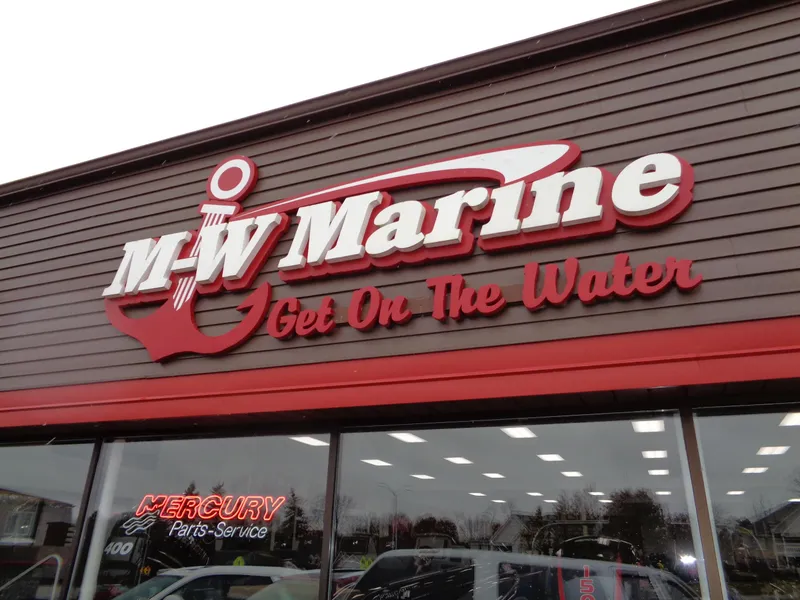 Slide: The Image of M-W Marine storefront with Get On The Water slogan and Mercury Parts-Service sign. - 32