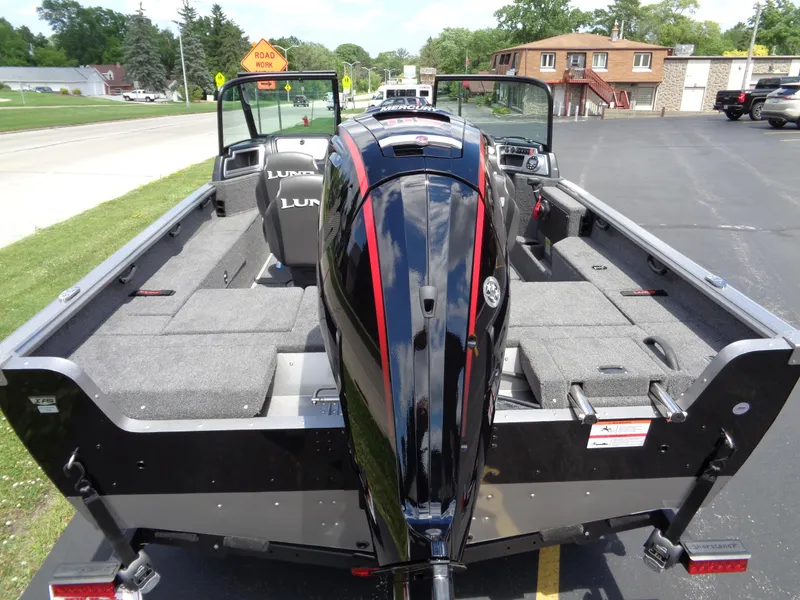 Slide: The Image of 2024 Lund 1775 Impact XS boat with outboard motor, rear view. - 9