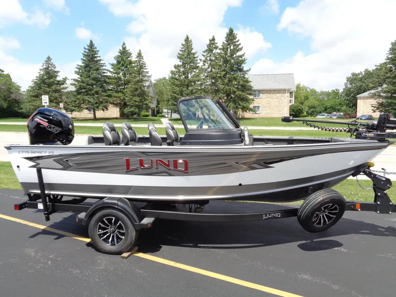 The Image of 2024 Lund 1775 Impact XS fishing boat on trailer. - 0