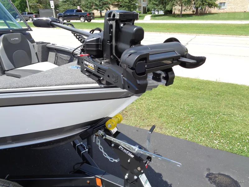 Slide: The Image of 2024 Lund 1775 Impact XS boat with mounted trolling motor. - 11