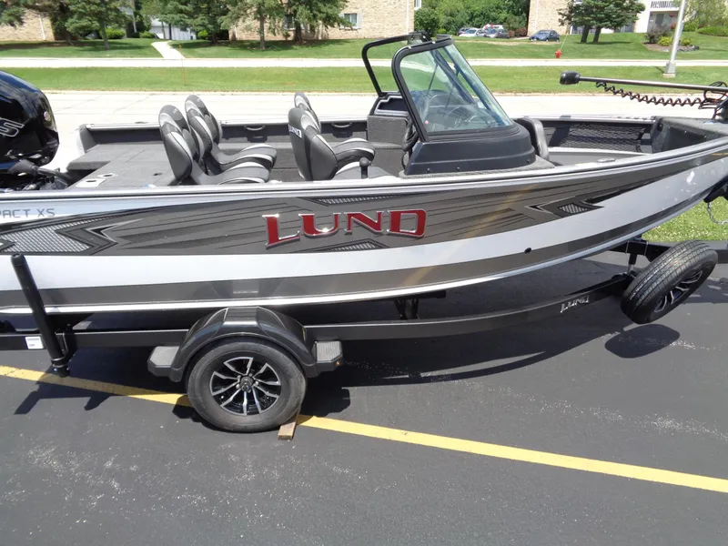 Slide: The Image of 2024 Lund 1775 Impact XS fishing boat on trailer, side view. - 3