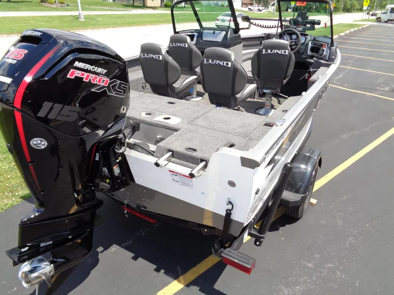 Slide: The Image of 2024 Lund 1775 Impact XS boat with Mercury Pro XS 115 engine, rear view. - 5