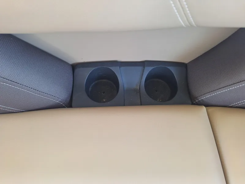 Slide: The Image of Cup holders in 2025 Sylvan Mirage 822 LZ boat with beige and gray seating. - 11