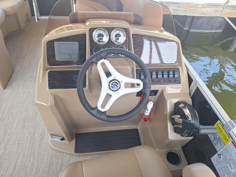 Slide: The Image of Steering console of 2025 Sylvan Mirage 822 LZ pontoon boat with modern controls and gauges. - 13