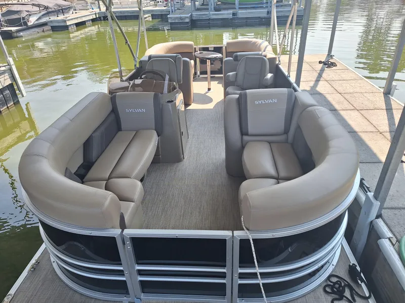 Slide: The Image of 2025 Sylvan Mirage 822 LZ pontoon boat with spacious seating at a dock. - 3