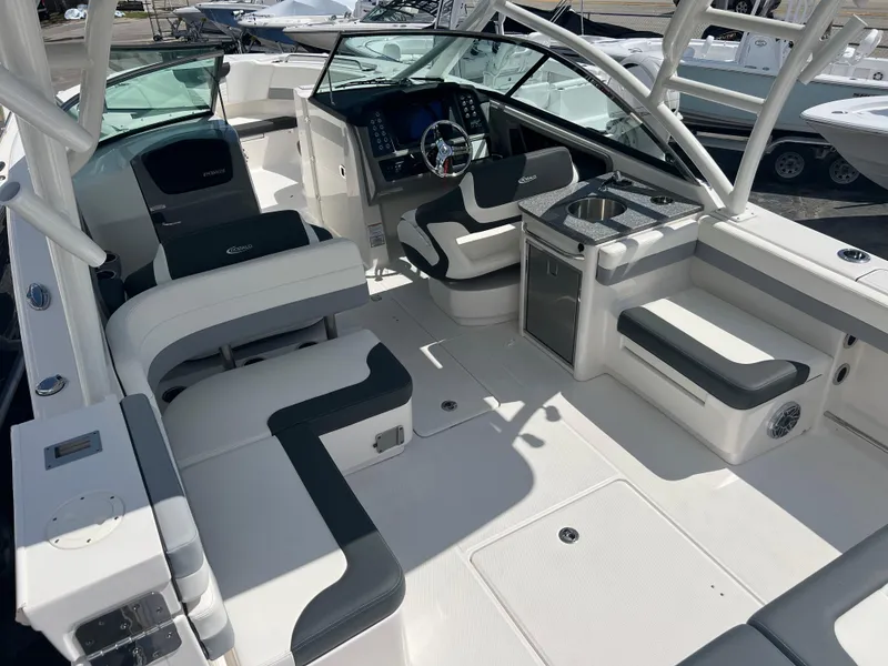 Slide: The Image of 2024 Robalo R317 Dual Console boat interior with seating and helm station. - 10