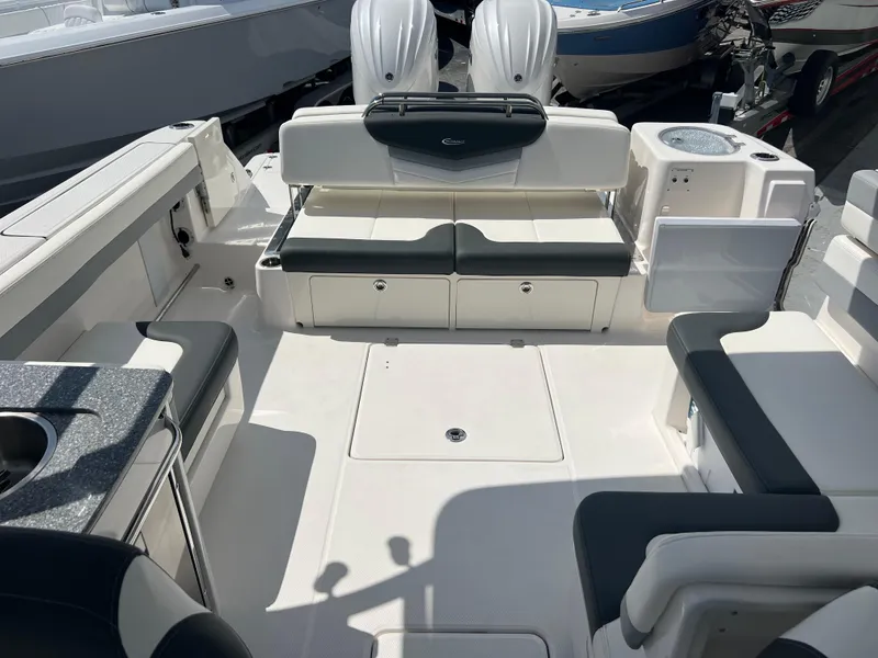 Slide: The Image of 2024 Robalo R317 Dual Console boat interior with seating and storage compartments. - 23