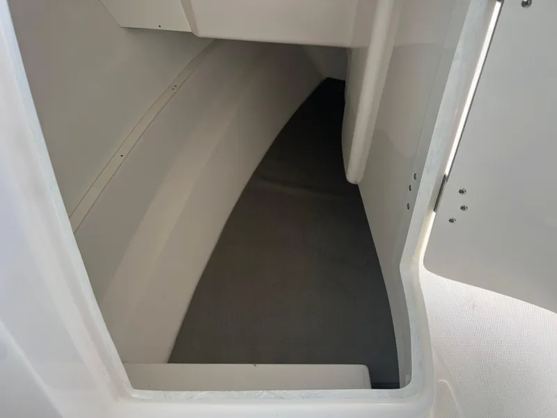 Slide: The Image of 2024 Robalo R317 Dual Console interior storage compartment. - 24
