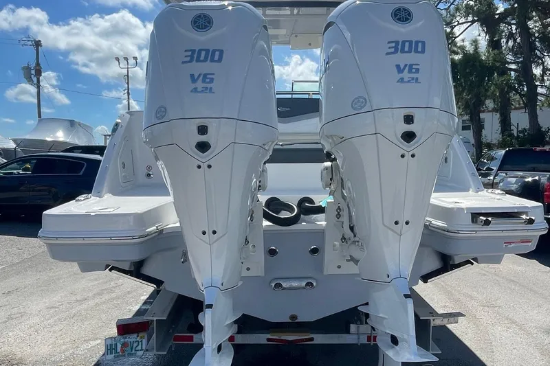 Slide: The Image of 2024 Robalo R317 Dual Console with twin Yamaha 300 V6 outboard engines. - 6
