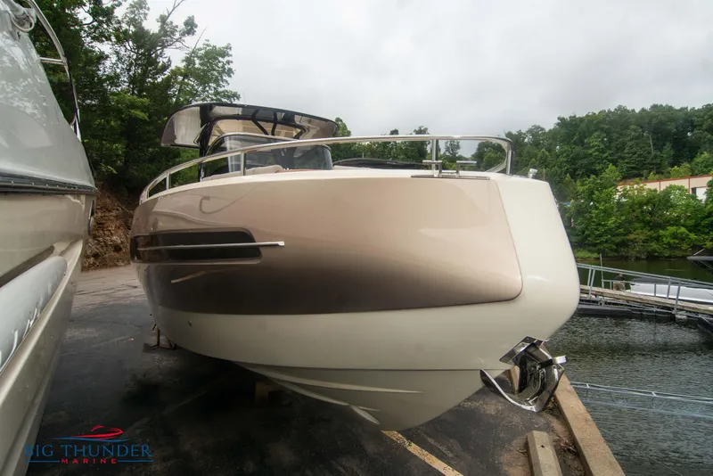 The Image of 2024 Invictus TT280S luxury boat docked near a serene lake. - 0