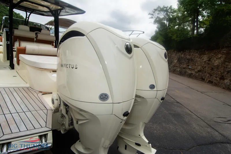 Slide: The Image of 2024 Invictus TT280S boat with twin outboard engines, rear view. - 3