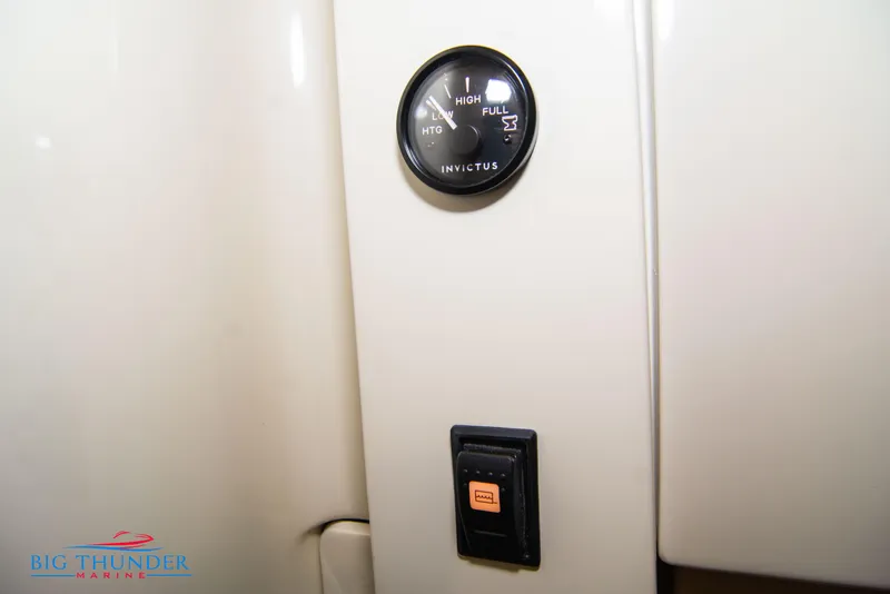 Slide: The Image of Invictus TT280S 2024 fuel gauge and switch panel on beige interior. - 35