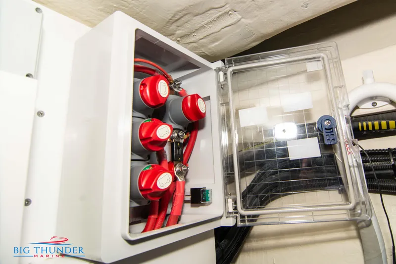 Slide: The Image of Electrical panel of 2024 Invictus TT280S boat with red cables and switches. - 42