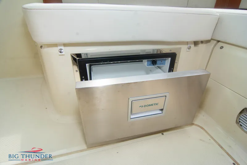 Slide: The Image of Built-in refrigerator on the 2024 Invictus TT280S boat by Big Thunder Marine. - 9