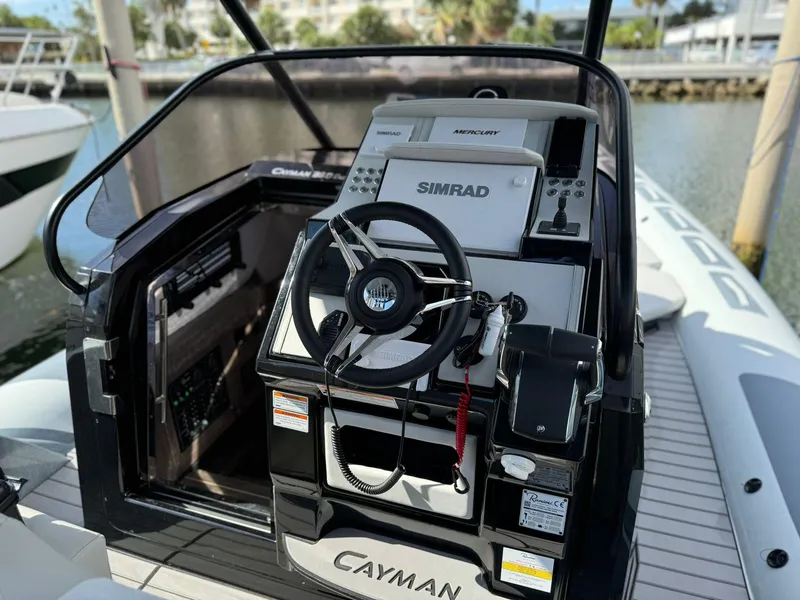 Slide: The Image of Ranieri CAYMAN 38.0 EXECUTIVE 2025 boat cockpit with steering wheel and Simrad navigation system. - 17