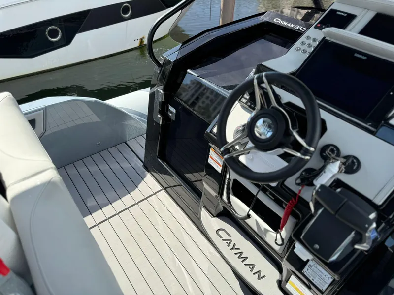 Slide: The Image of Cockpit view of 2025 Ranieri CAYMAN 38.0 EXECUTIVE boat with modern steering and controls. - 18