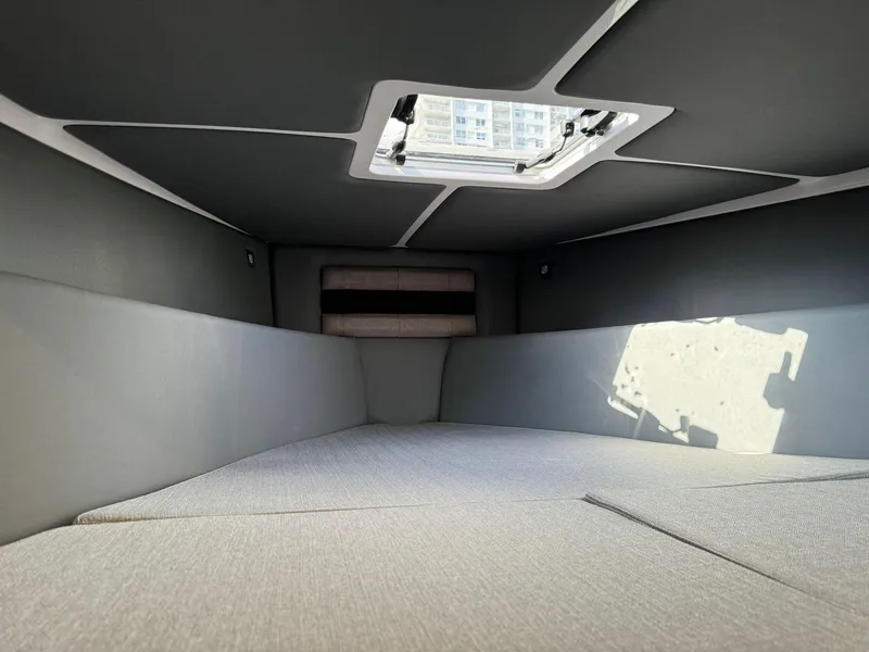 Slide: The Image of Interior cabin of the 2025 Ranieri CAYMAN 38.0 EXECUTIVE boat with a skylight. - 26