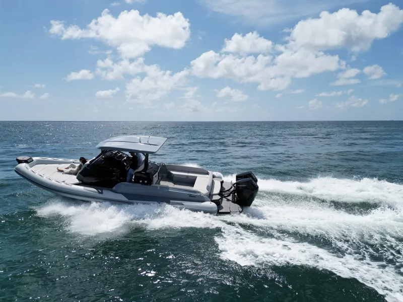 Slide: The Image of 2025 Ranieri CAYMAN 38.0 EXECUTIVE boat cruising on open water. - 3