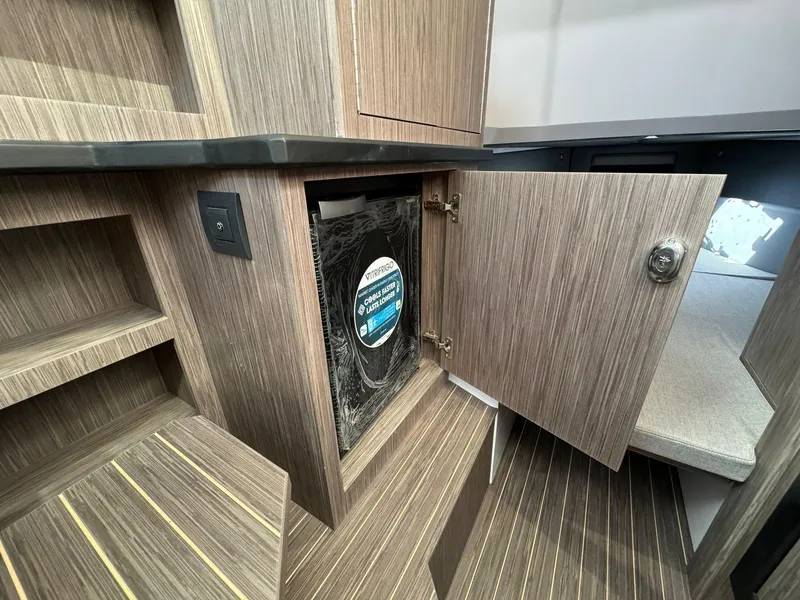 Slide: The Image of Interior of 2025 Ranieri CAYMAN 38.0 EXECUTIVE yacht with open cabinet. - 31