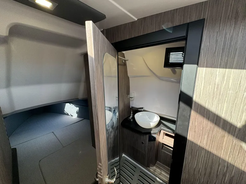 Slide: The Image of Interior cabin of 2025 Ranieri CAYMAN 38.0 EXECUTIVE with modern bathroom and sleeping area. - 32