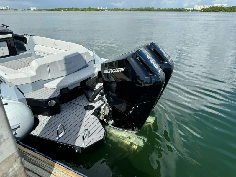 Slide: The Image of 2025 Ranieri CAYMAN 38.0 EXECUTIVE boat with dual Mercury engines on calm water. - 42