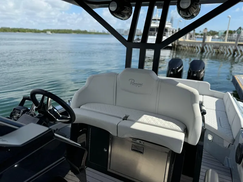 Slide: The Image of 2025 Ranieri CAYMAN 38.0 EXECUTIVE boat interior with steering wheel and seating. - 43
